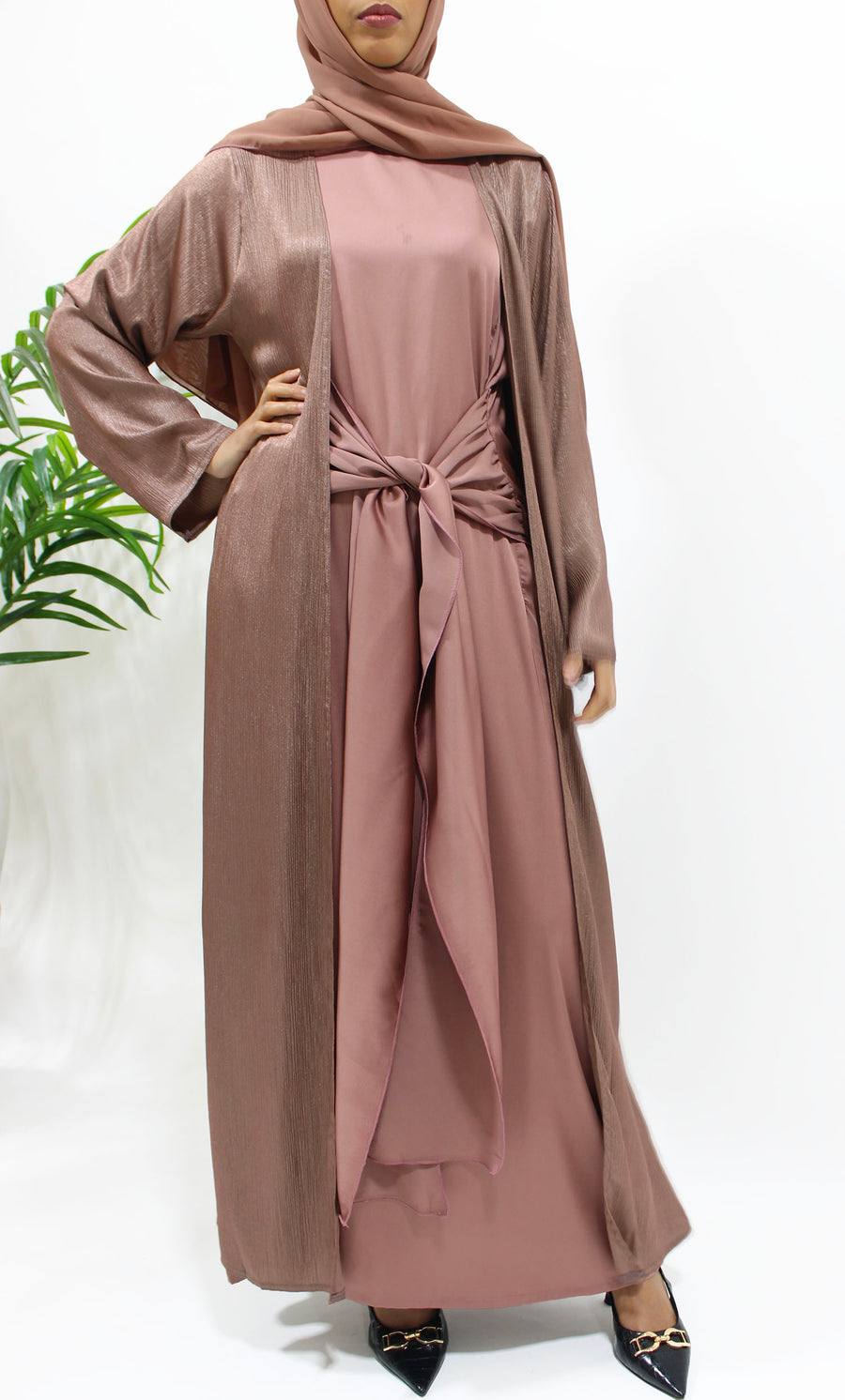 Side view of the rosewood shimmer open jacket abaya over the inner dress