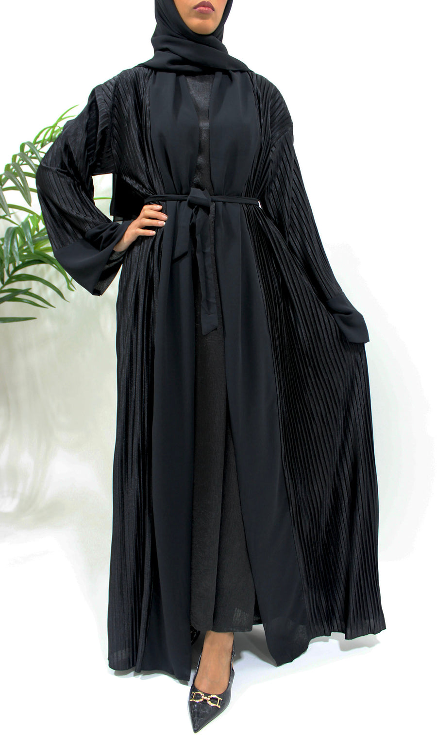 Full-length view of the black pleated satin open abaya with matching hijab