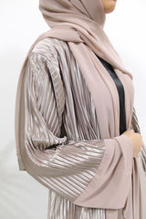 Pink nude pleated satin open abaya shown front-on with matching belt and hijab