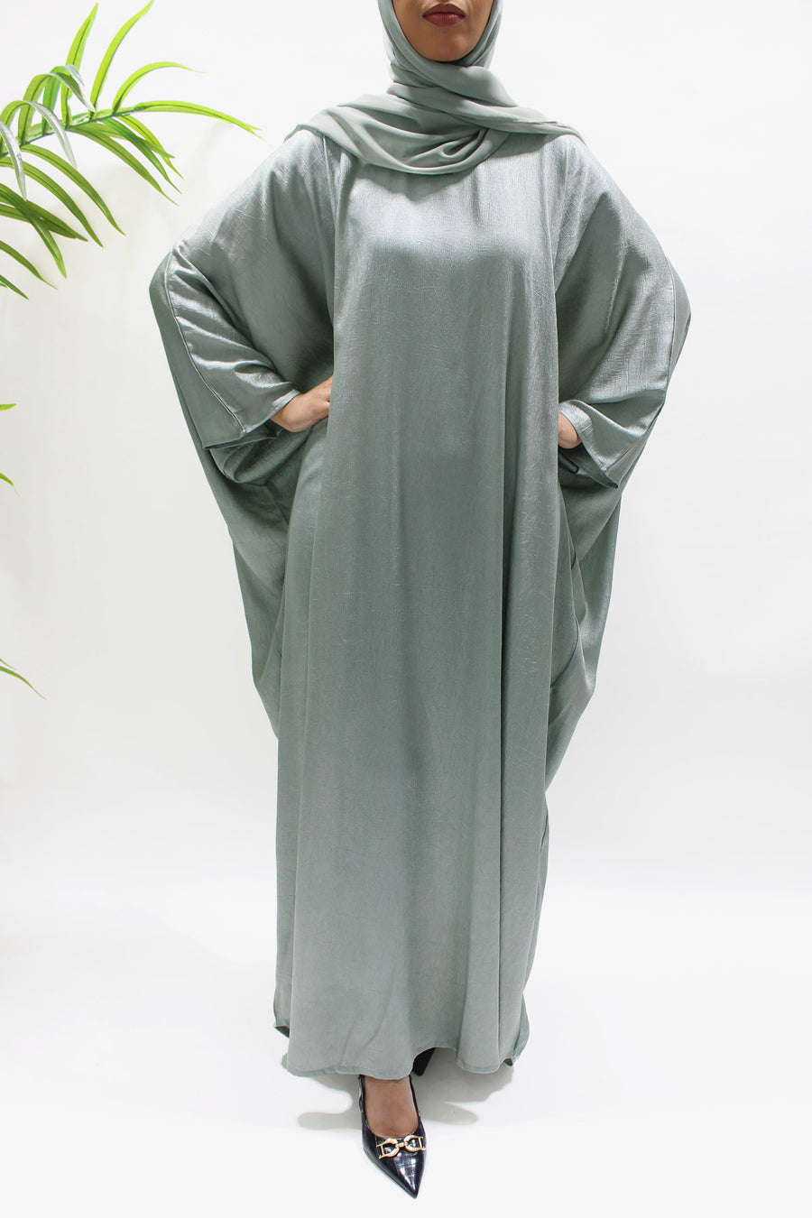 Full-length view of the sage farasha abaya with matching hijab