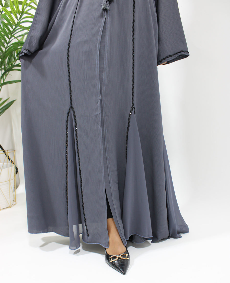 Full-length view of the slate grey diamante-piped open abaya with matching hijab
