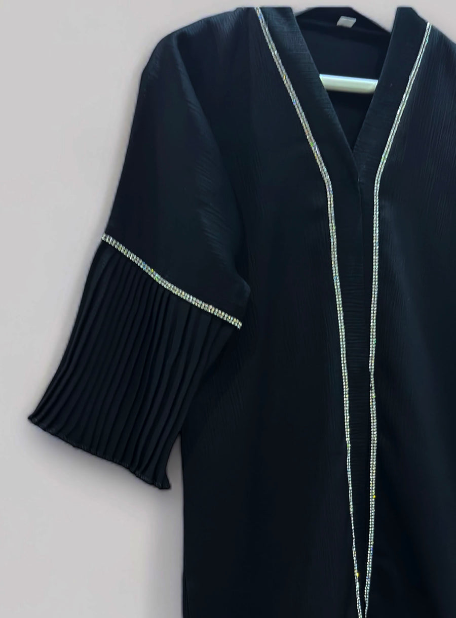 Full-length view of Amani's toddler silver embellished open abaya set