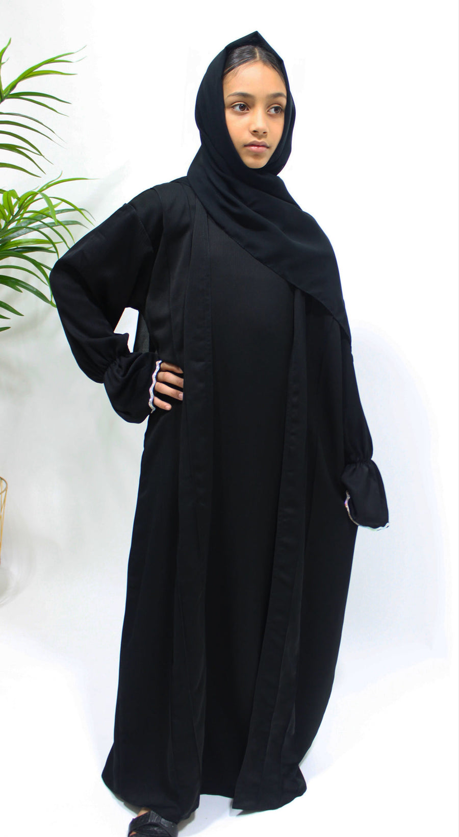 Embellished cuff detail on the black girls' open abaya