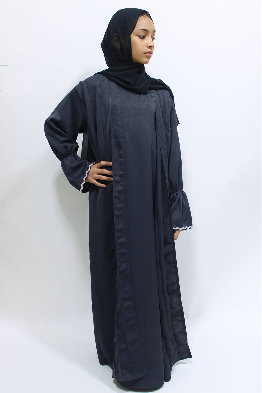 Full-length view of Amani's dark grey two piece style open abaya