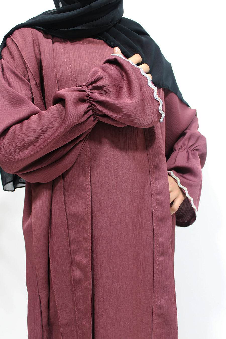 Embellished cuff detail on the plum girls' open abaya