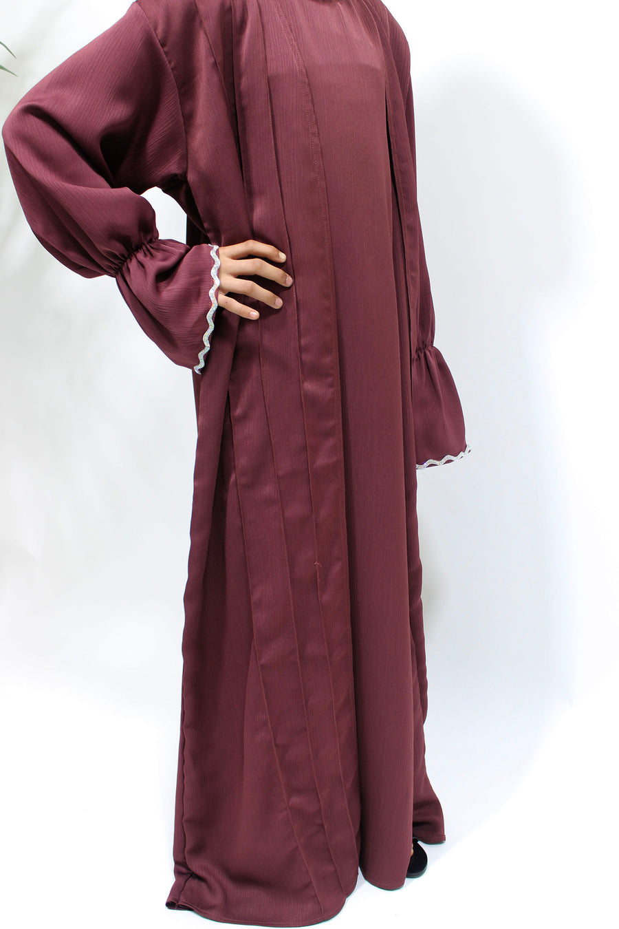 Layered two-piece effect of the plum kids' open abaya