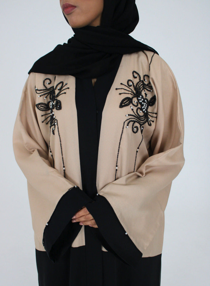Cream and black open abaya jacket, front view