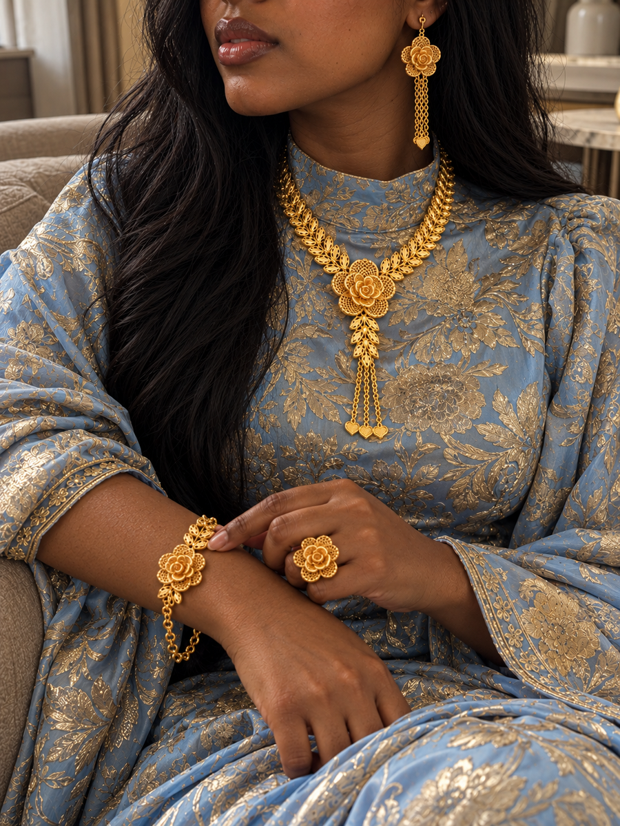 Model wearing Amani's 24K gold-plated rose and leaf jewellery set with earrings bracelet and ring