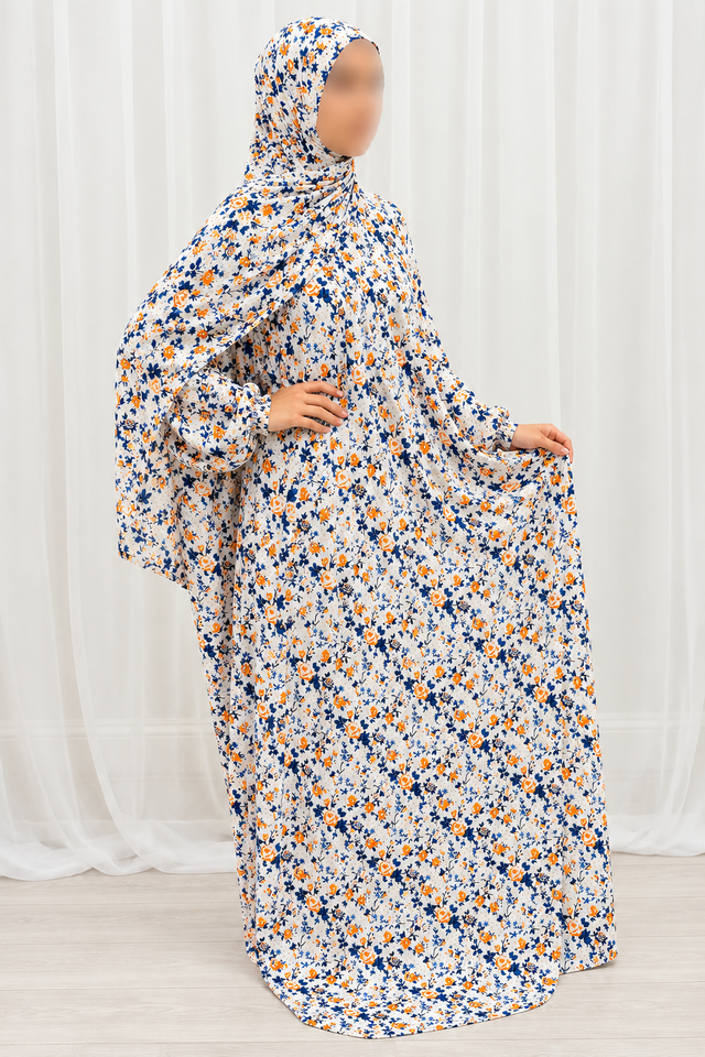 Amani's eggshell white floral one-piece prayer dress with attached hijab, front view, natural sleeves and no lace
