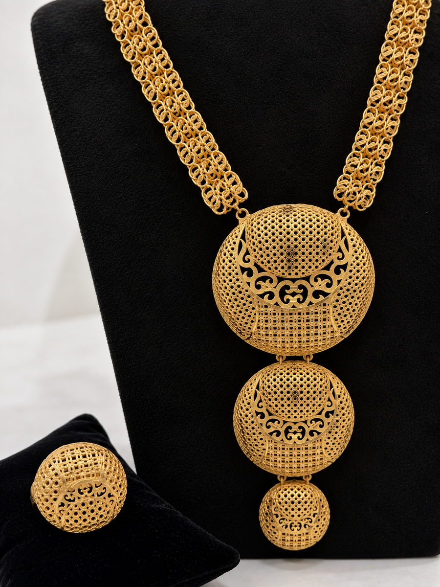 Close-up of 1 gram gold-plated filigree medallion necklace and ring