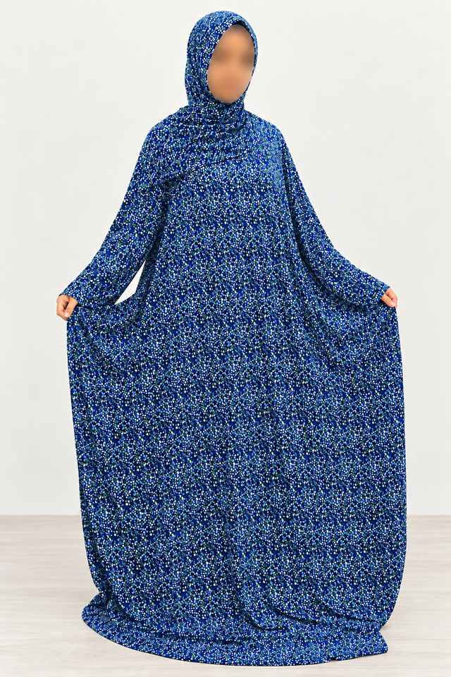 Amani's royal blue micro floral one-piece prayer dress with attached hijab, front view showing straight sleeves, full width and no lace