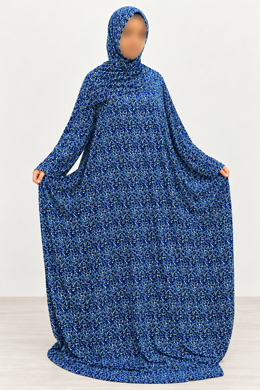 Amani's royal blue micro floral one-piece prayer dress with attached hijab, front view showing straight sleeves, full width and no lace