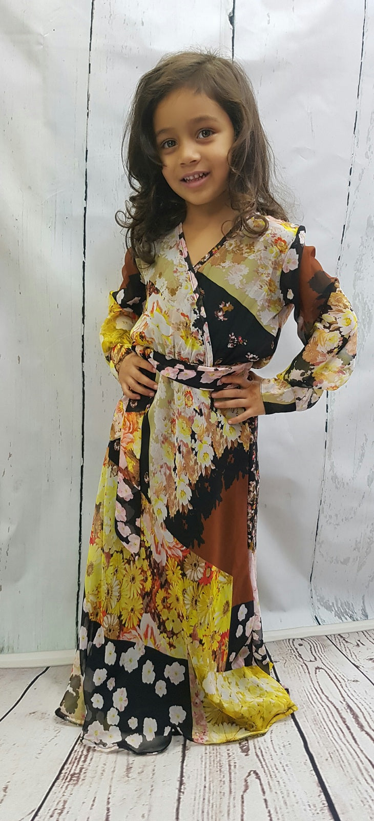 Girl wearing Mia's shirt-collar floral chiffon long-sleeve maxi dress