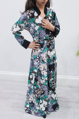 Girl wearing Amani's grey floral umbrella-cut kids maxi dress