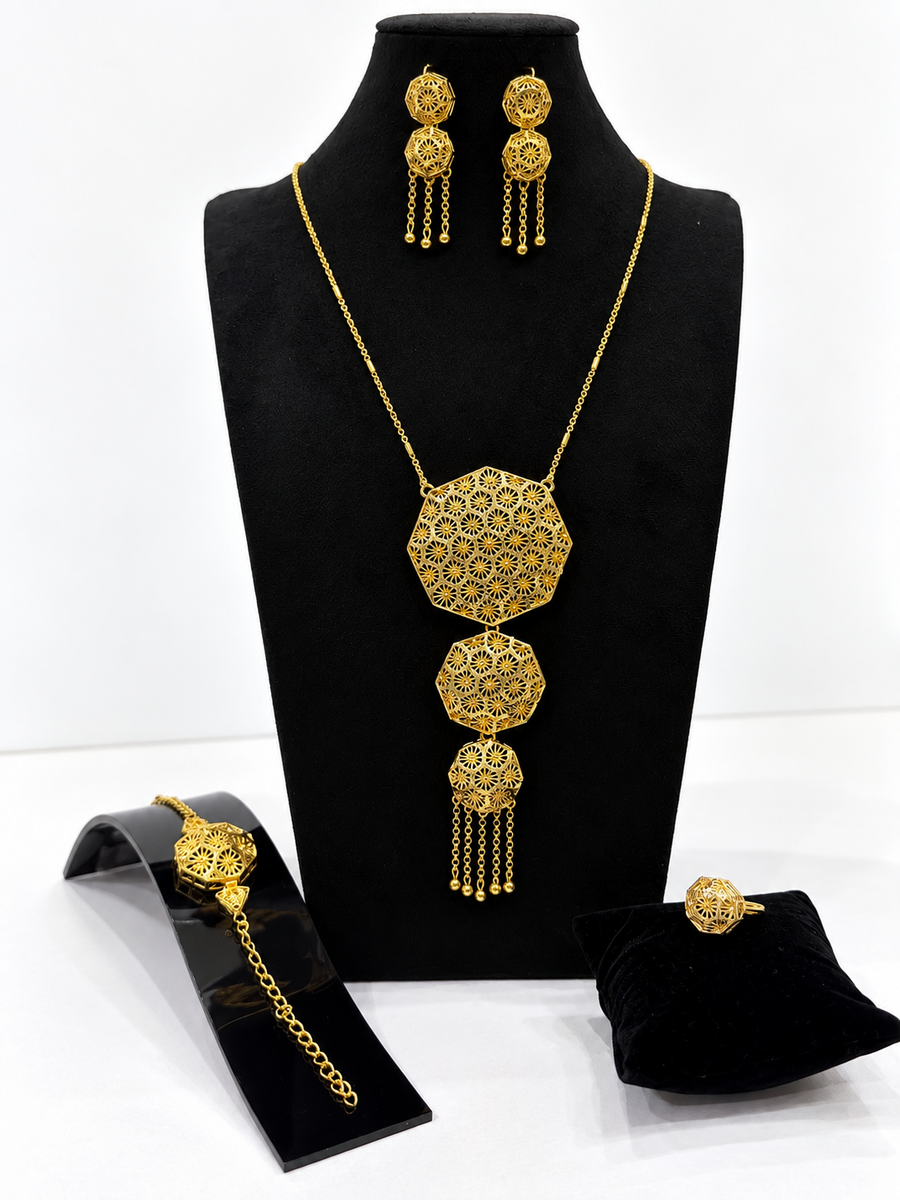 Gold-tone octagon starburst jewellery set with necklace earrings bracelet and ring
