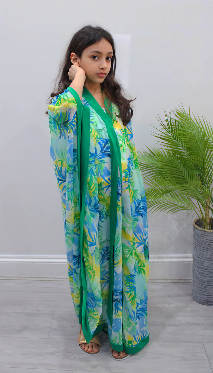 Green palm-print chiffon kids kaftan showing the draping side-opening cut