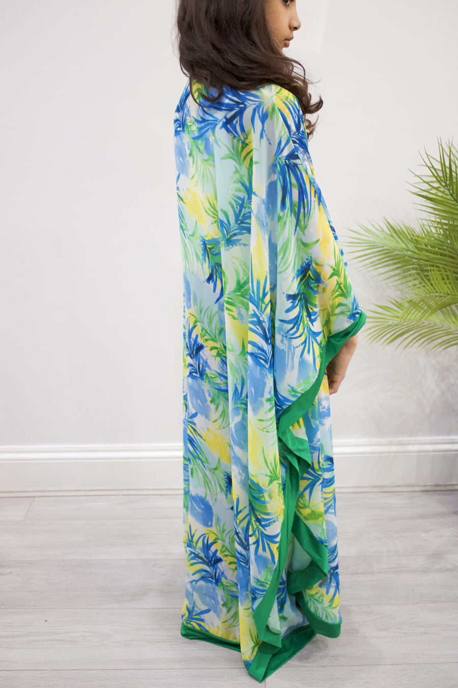 Full-length view of Amani's green palm-print chiffon kids kaftan