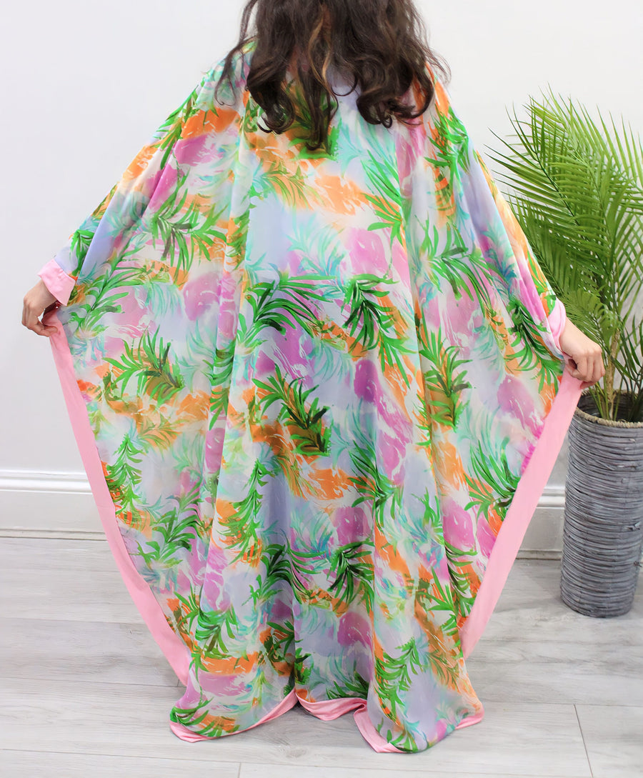 Pink floral chiffon kids kaftan showing the side-opening cut