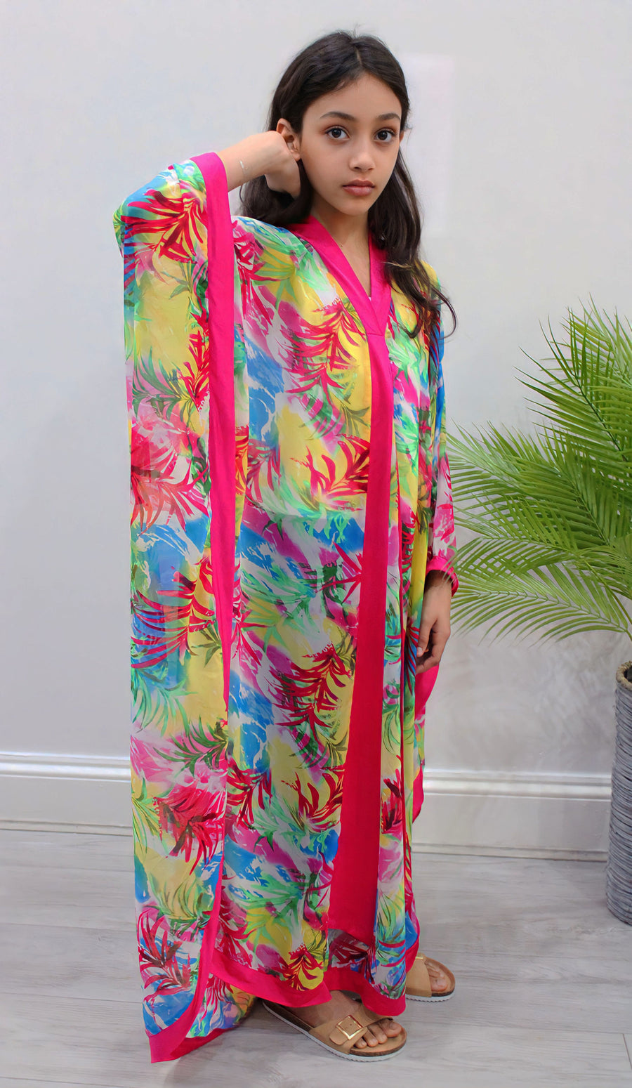 Close-up of the fuchsia floral chiffon print on the kids kaftan