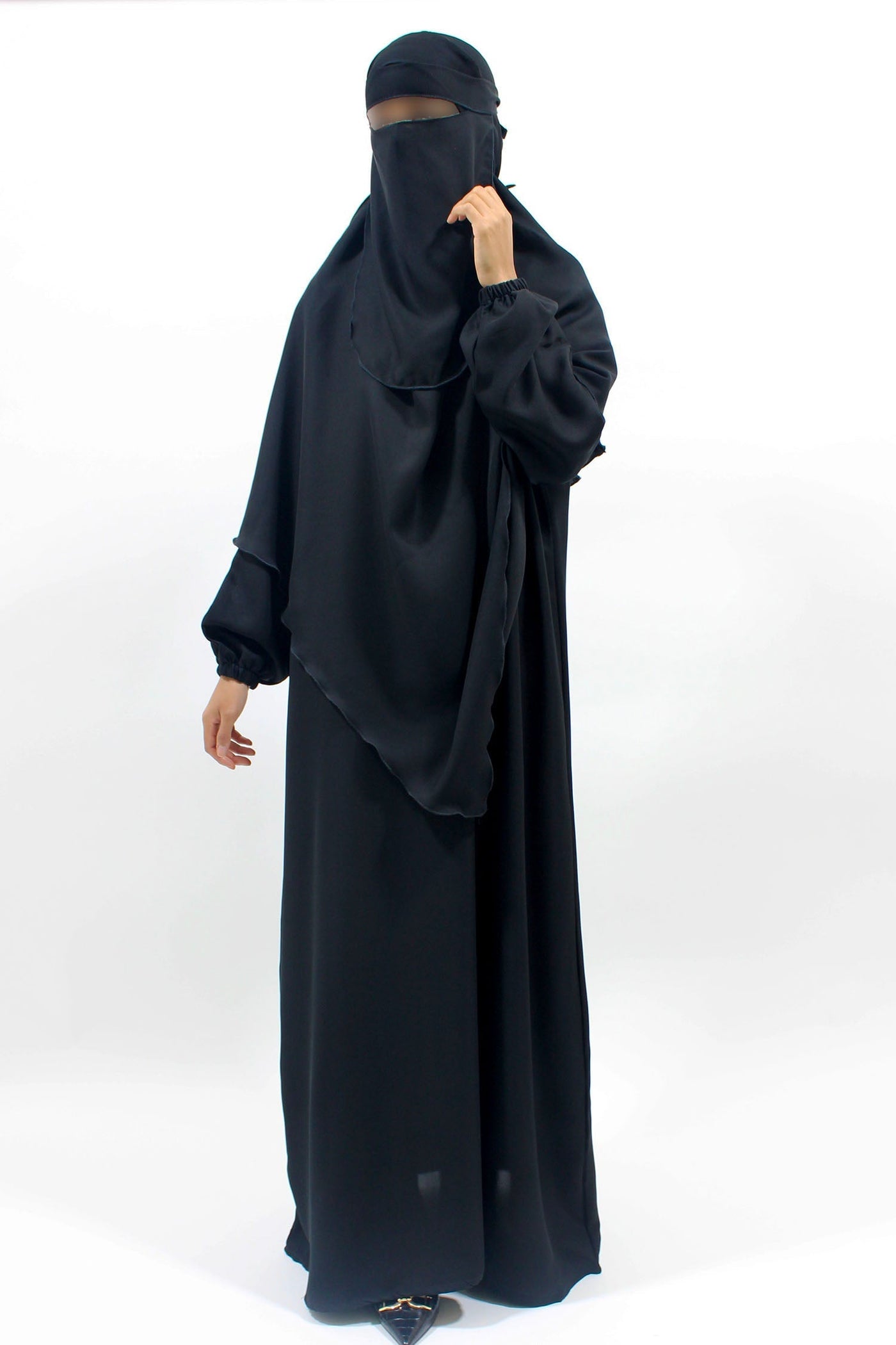 Black abaya, khimar and niqab set showing coordinated modest coverage