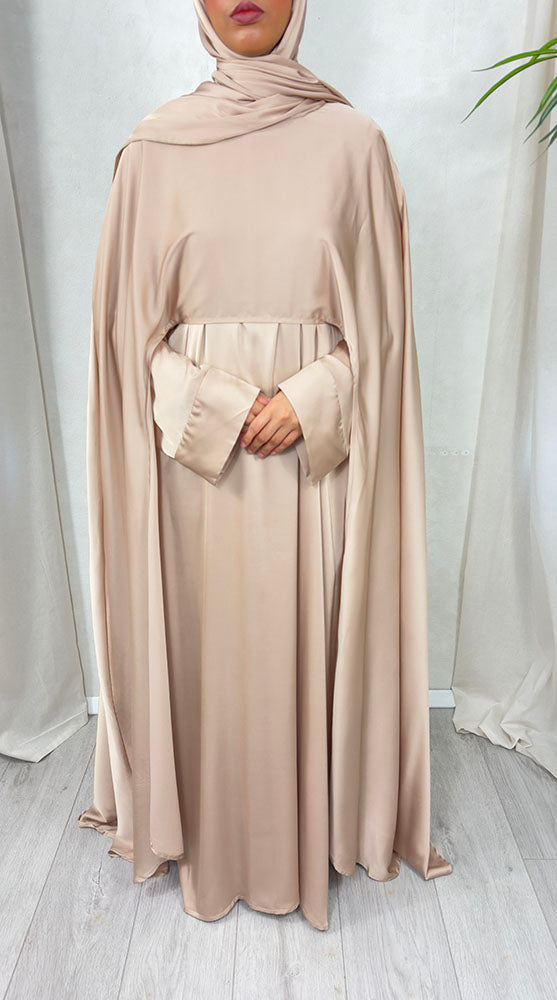Warm beige satin abaya set illustrating delicate modest-wear fabric care