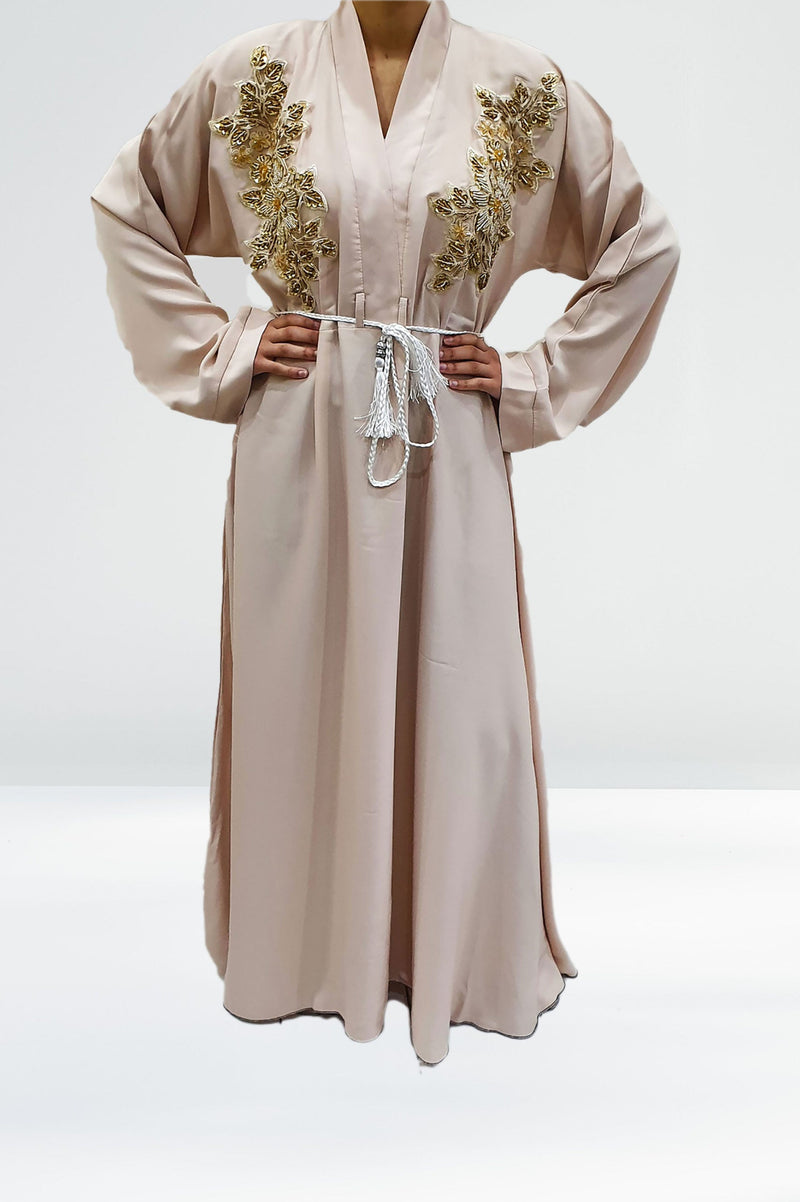 Cream and gold floral full-length modest dress inspiration for a nikah look