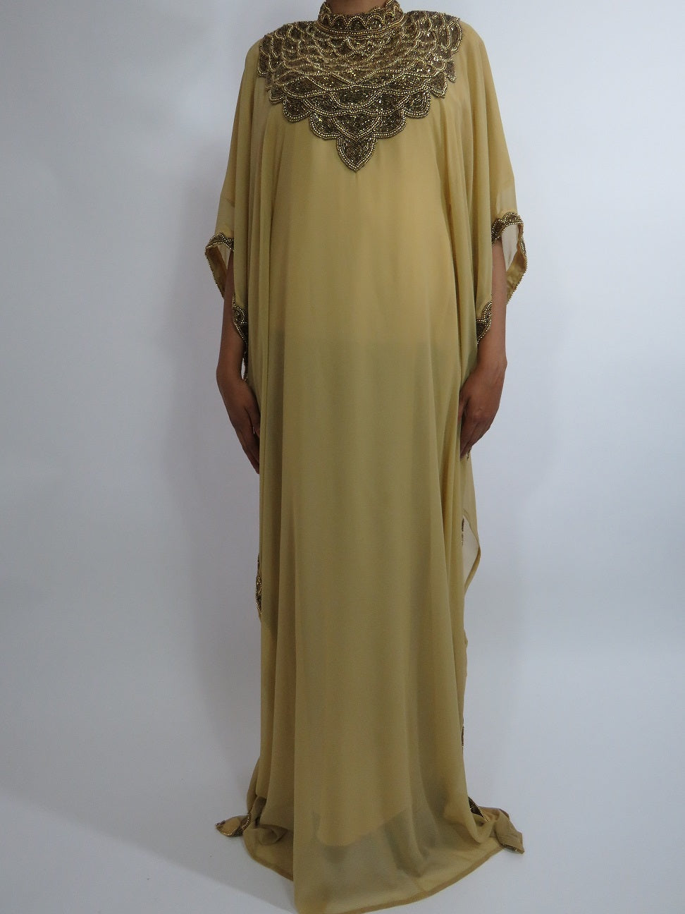 Caramel Moroccan occasion kaftan with gold beadwork for a modest kaftan and hijab styling guide