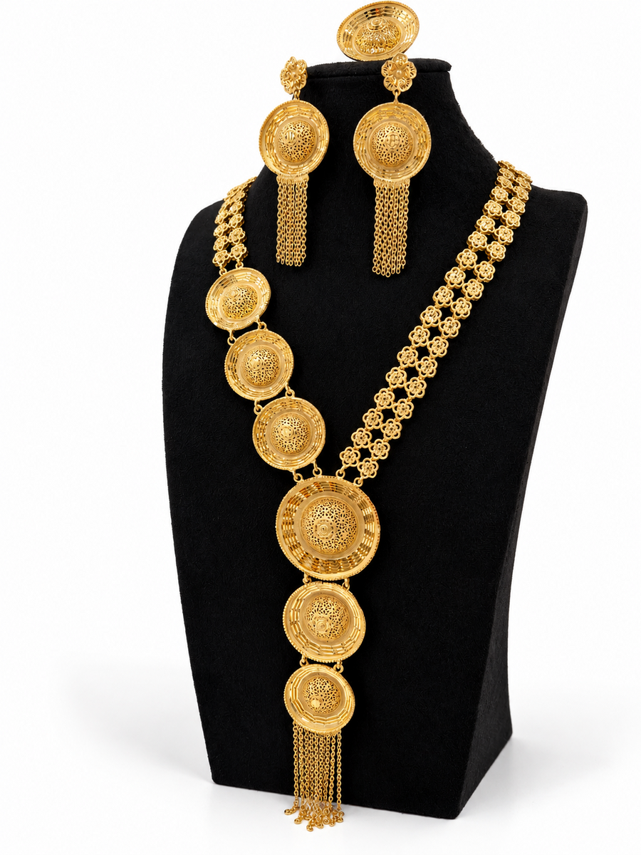 Angled view of 1 gram gold-plated circular filigree necklace and matching earrings