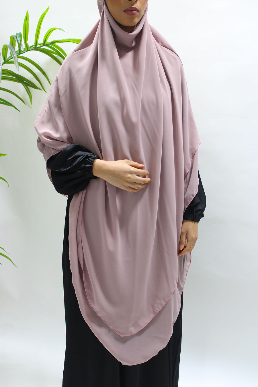 Rose mauve chiffon khimar showing its warm tone and soft draped layers