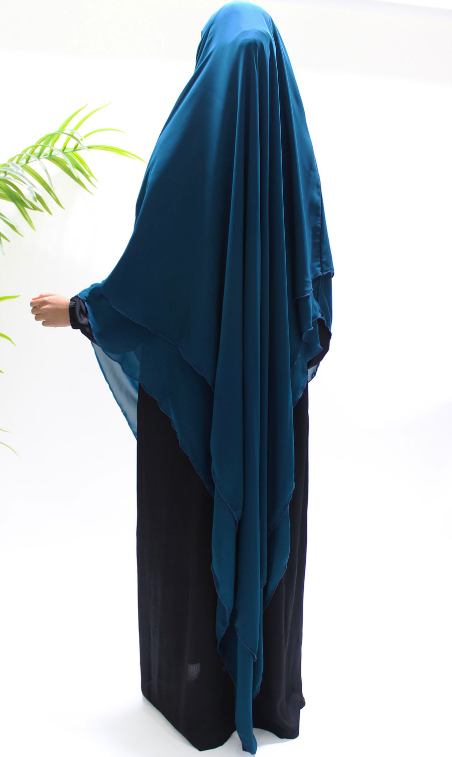 Close-up of the teal diamond chiffon fabric texture
