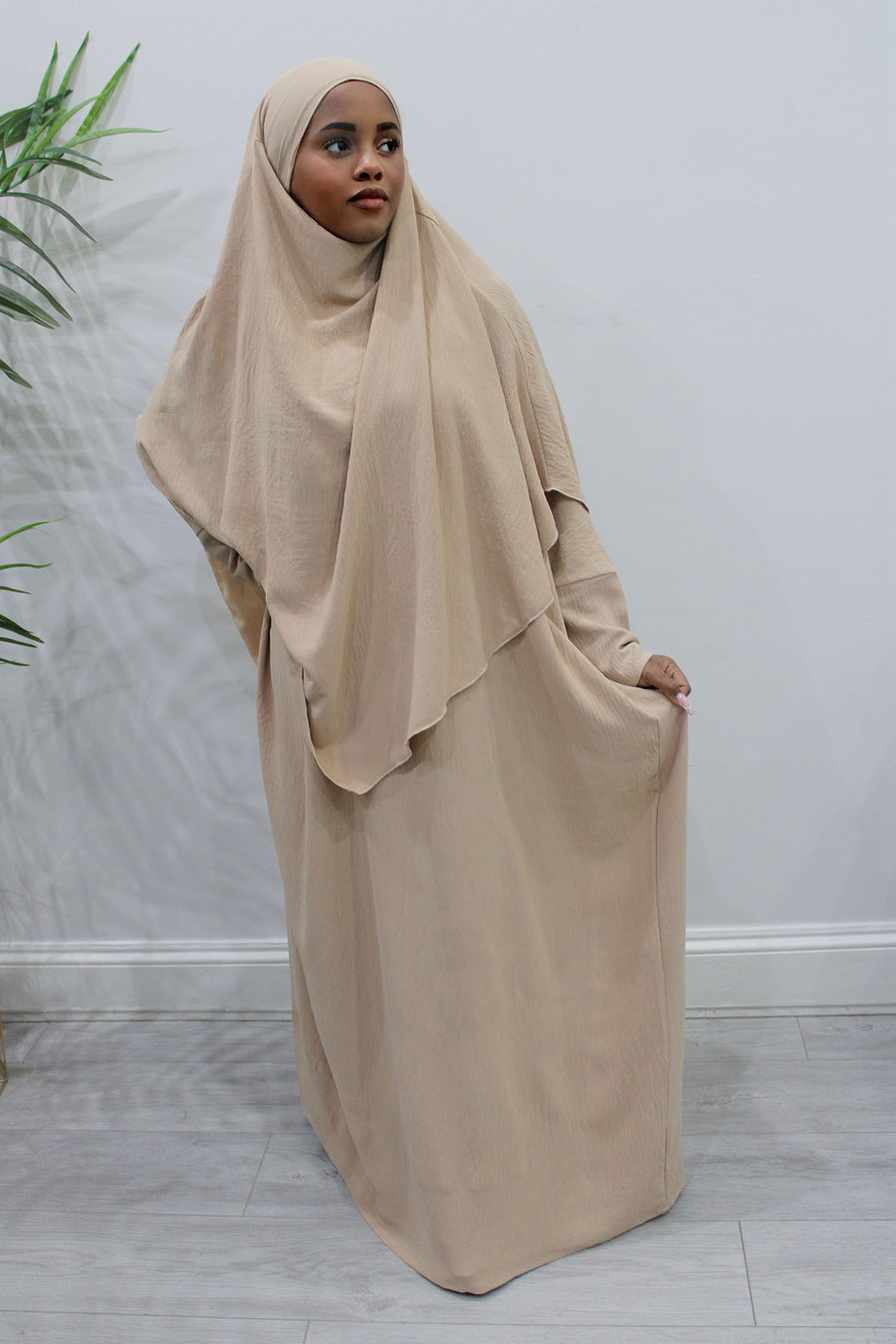 Buff diamond-shaped khimar showing full chest coverage