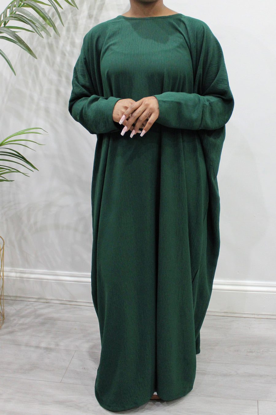 Forest green diamond-shaped khimar showing full chest coverage