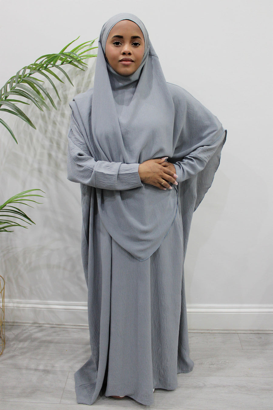 Light grey overhead abaya showing the loose fit and crepe drape