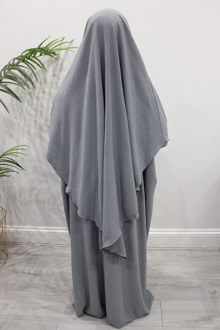 Close-up of the light grey soft crepe fabric