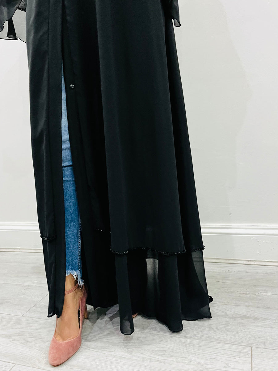 Black layered chiffon abaya shown with its matching hijab and belt