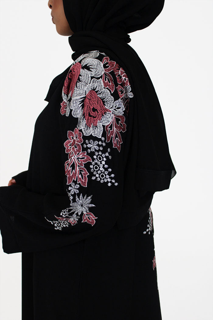 Black abaya with floral embroidery on the shoulders and sleeves, front view