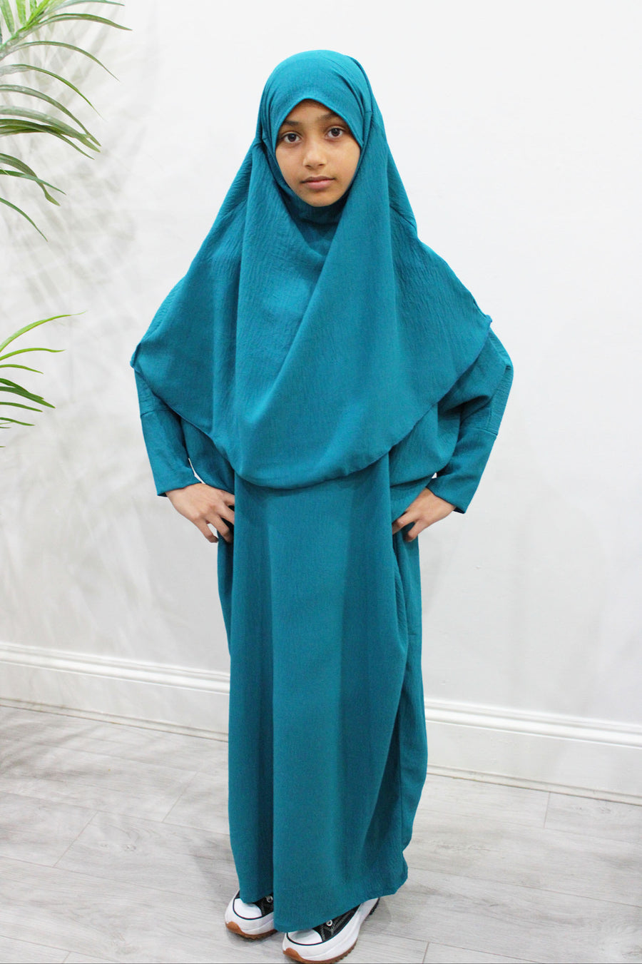 Dark turquoise diamond-shaped girls' khimar with tie-back straps