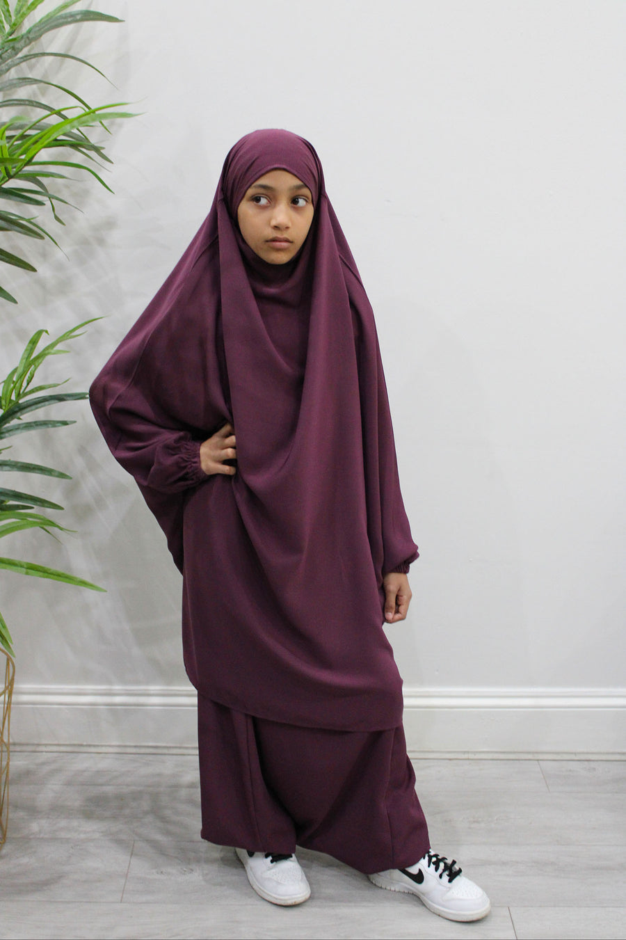 Side view of girls' plum sarouel jilbab showing the drape