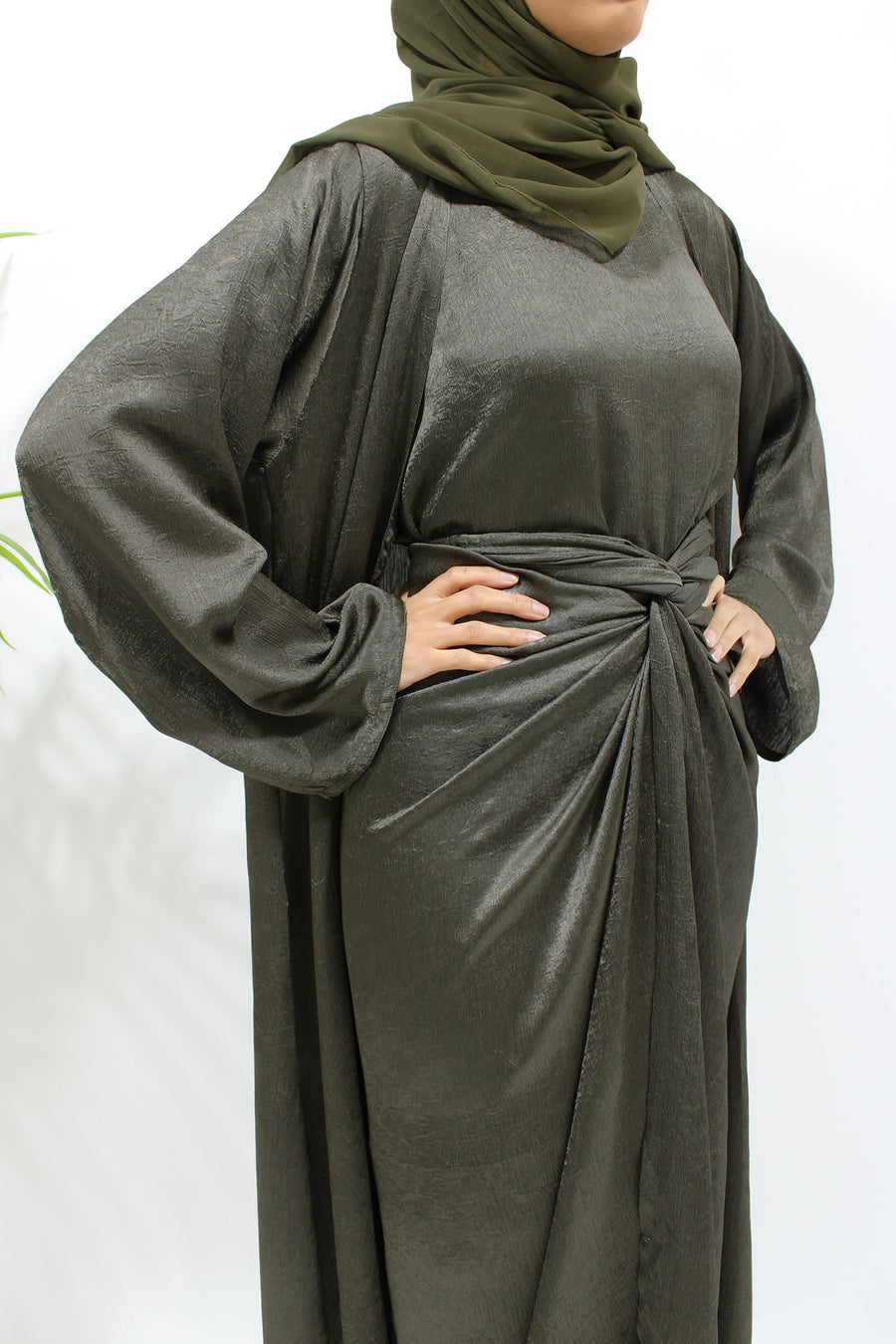 Full-length view of the army green crushed satin four-piece set with flowing open kimono abaya