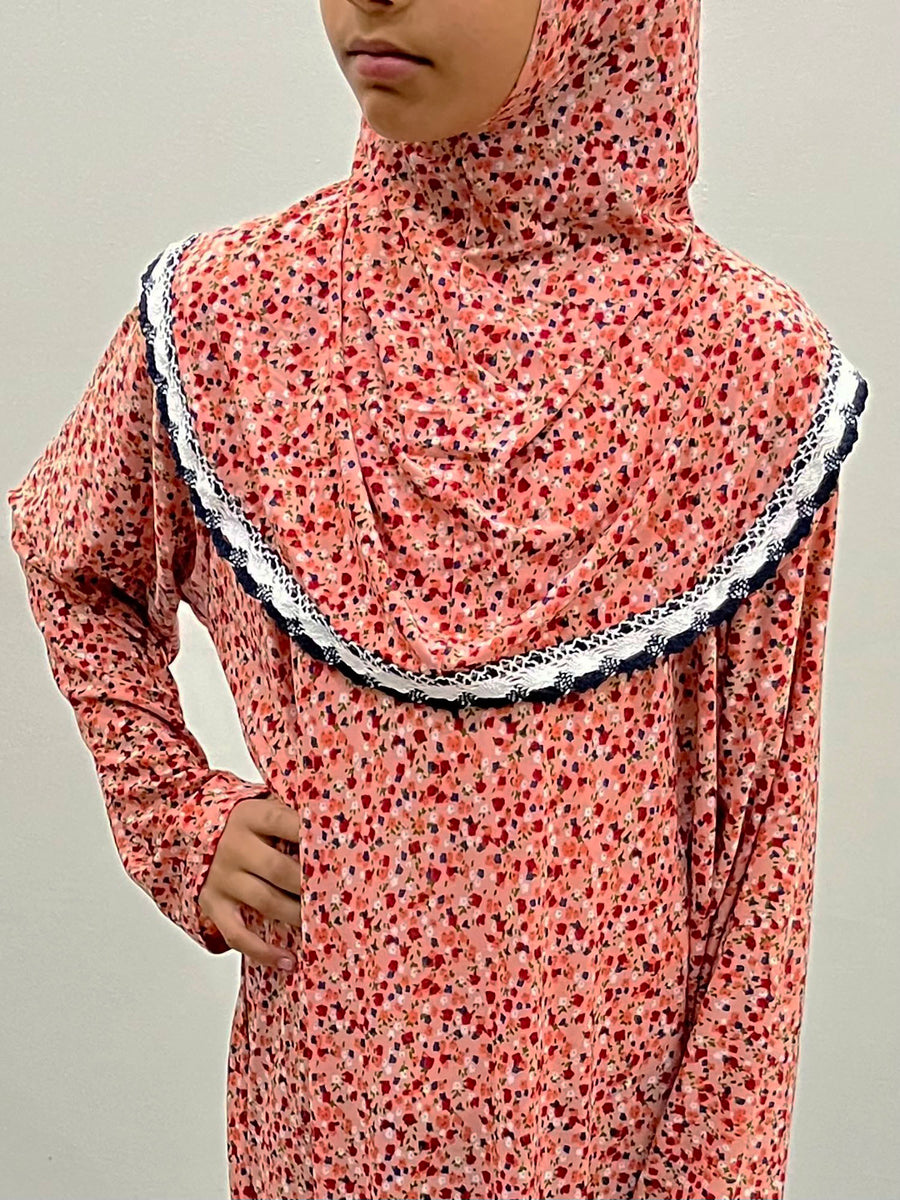 Coral girls' prayer dress with attached hijab, full-length view