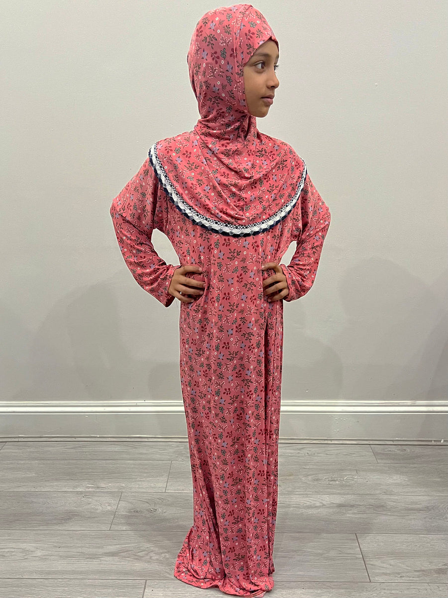 Little girl wearing Amani's pink rose one-piece slip-on prayer dress with attached hijab