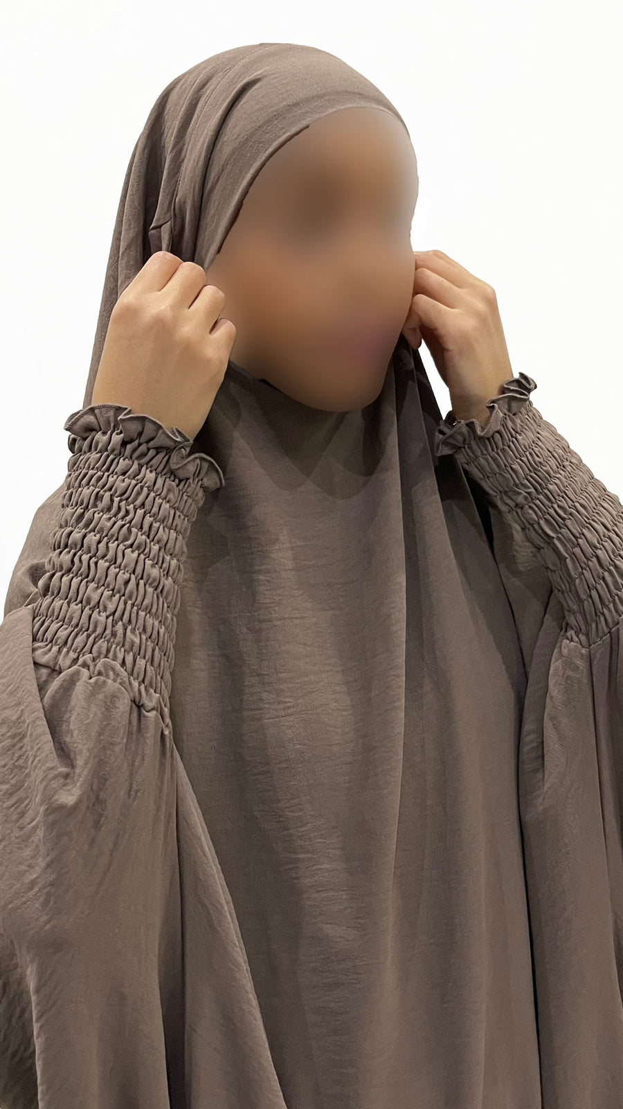 Side view of the dark taupe full jilbab showing its graceful drape