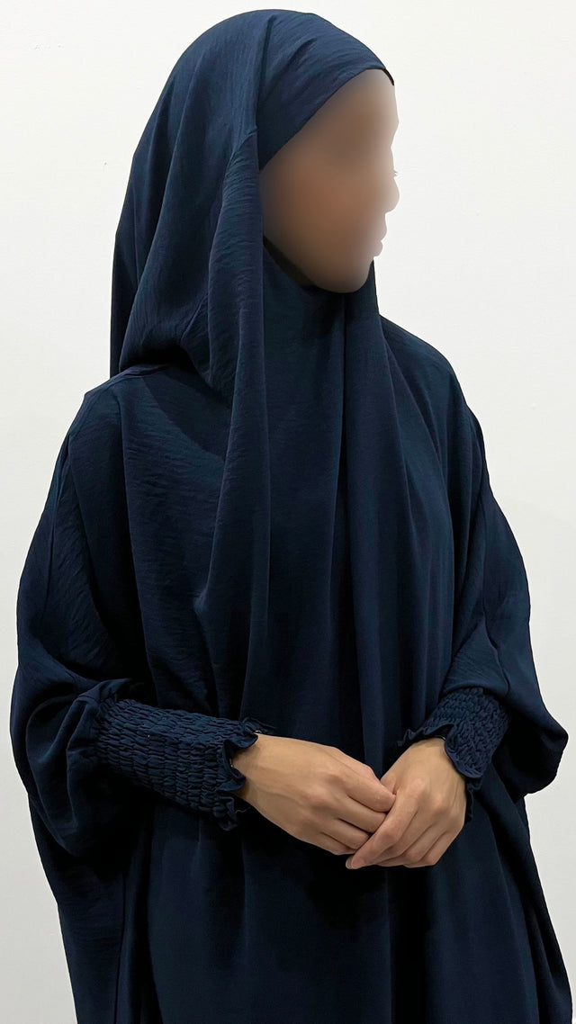 Navy blue one-piece overhead full jilbab with ruched cuffs, front view