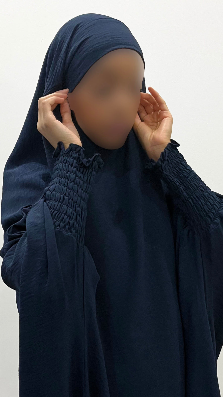 Close view of the ruched cuff on the navy blue full jilbab