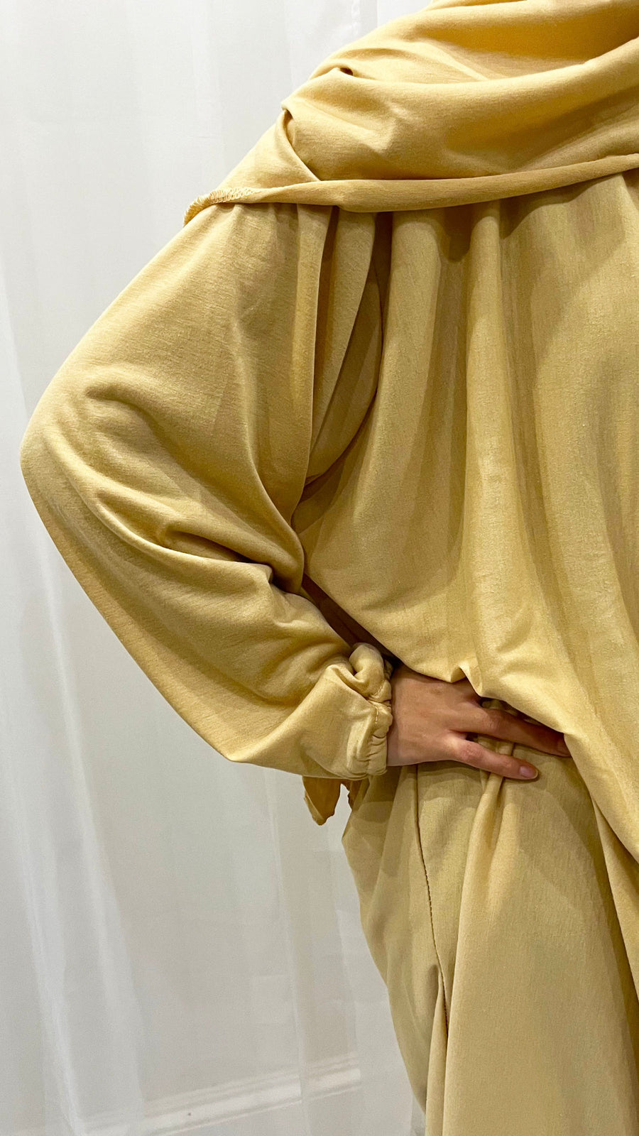 Soft yellow cotton stretch prayer dress showing the attached wrap-around hijab