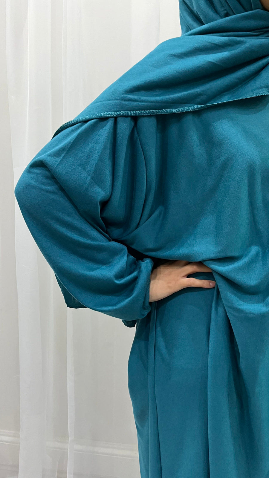 Teal blue cotton stretch prayer dress showing the attached wrap-around hijab