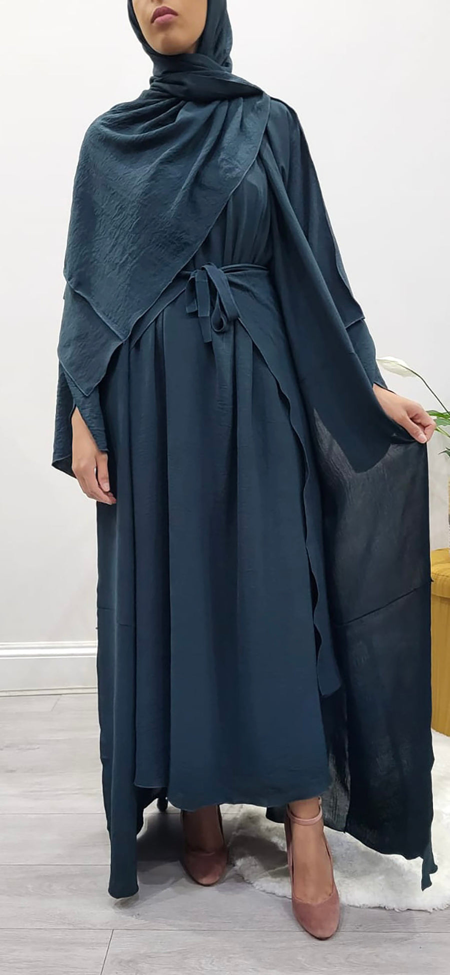 Teal three-piece abaya shown with its matching hijab