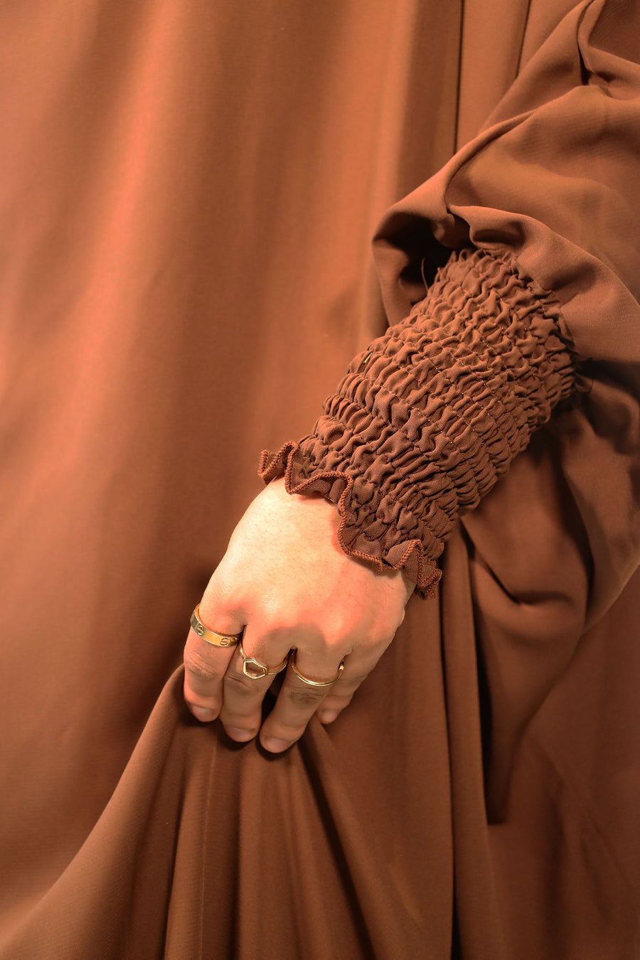 Chocolate jilbab set showing the overhead top with longer back and ruched cuffs