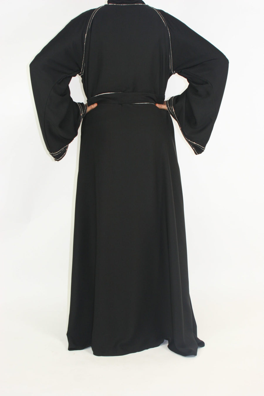 Silver-bordered open abaya belted at the waist