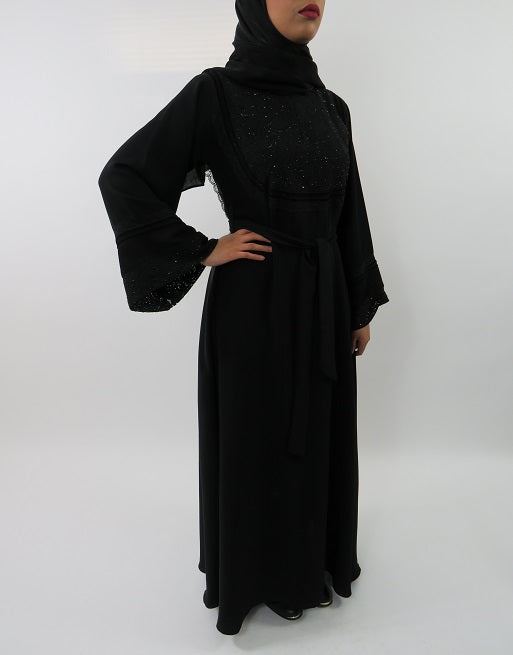 Black lace abaya showing collared neckline and tie belt